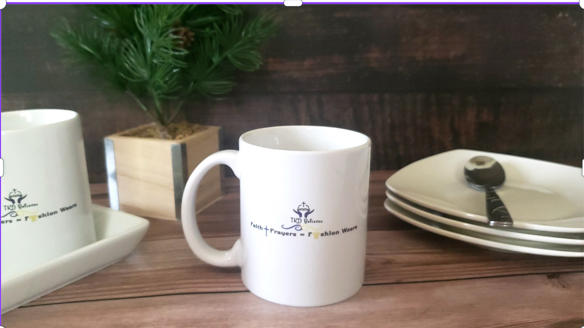White ceramic mug with TKD Believes logo and "Faith+Prayers = Fashion Wears" design