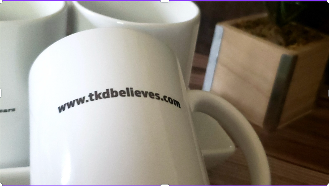 White ceramic mug with TKD Believes logo and "Faith+Prayers = Fashion Wears" design